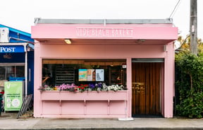 Exterior view of the pink Olde Beach Bakery.