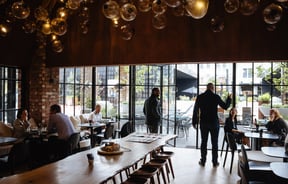 Hanging bulb lights inside Ortolana.