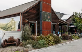 Wooden building exterior of Paulina's Bar.