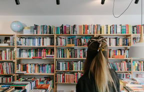 Woman looking at books at Petronella's Gallery and Bookstore, Tekapo.