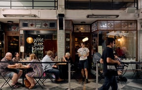 Entrance of Pici Pasta in Auckland with people dining outside in the arcade