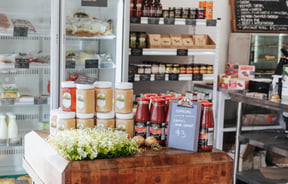 Jars of pasta sauce and honey on display.