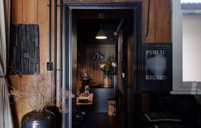 The dark entrance into Public Record Auckland.