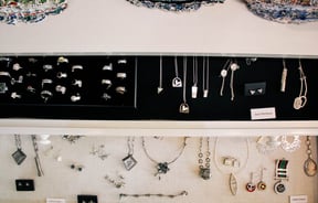 Jewellery in display cabinets.