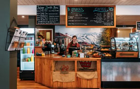 Front counter, cabinet and coffee machine at Recharge Bar & Cafe.