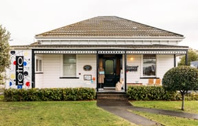 The exterior of a small house that is home to Retro Gisborne.