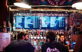 Two men at the bar.