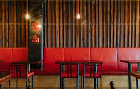 Red leather bench seating at Saikou, Timaru.