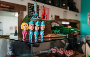 Thunderbird figurines and toy spaceships on the counter at Space Cadet, Hamilton.