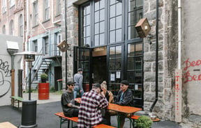 People sitting outside Steamer Basin having a beer.