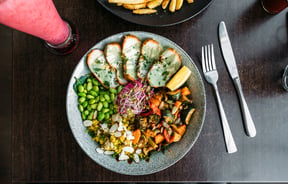 A healthy salad bowl on a table.