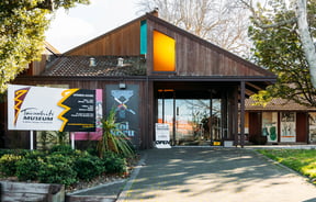 The wooden exterior of Tairāwhiti Muesum. on a sunny day.