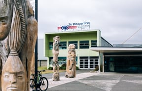 Arena with a Maori sculpture out the front.