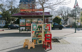 Kids secondbook shop area at The Custard Square Bookshop with the tram sign and road in the background