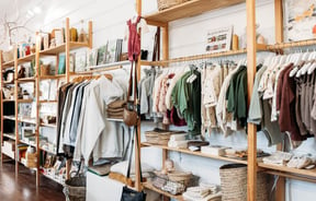 Baby clothings on racks inside The Aviary Gisborne.