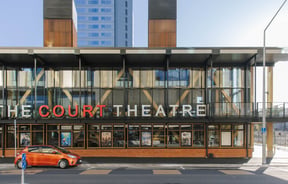 Signage on the exterior of the theatre building at The Court Theatre.