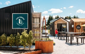 Outdoor common space with different buildings at The Green.