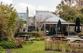 Tables outside the main building of The Herb Farm.