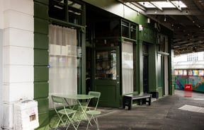 The green exterior of The Lebanese Grocer Auckland.