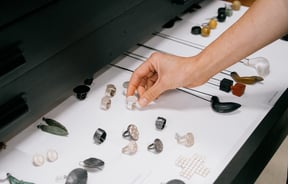 Person reaching for jewellery in drawer at The National gallery in Christchurch