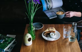 Cake and coffee on a table.