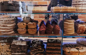 Close up of food in the glass cabinet.