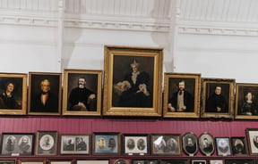 Portraits on a wall.