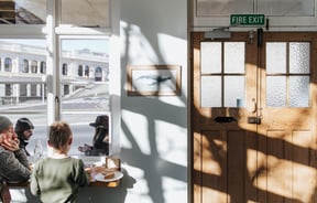 Customers dining at the window seats.
