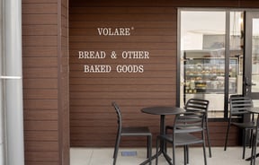 Volare Bread building exterior and signage on the wall.