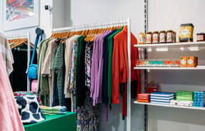 Colourful clothes and candles displayed inside Wanda Harland in Petone.
