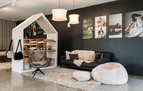 Sofa display and a large shelving unit display at Wilson & Dorset.