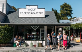 The exterior of the Wolf Coffee Roasters on a sunny day.