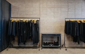 Black clothes on racks.