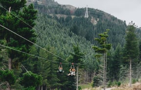 Someone zip-lining at Christchurch Adventure Park in the Port Hills, Christchurch.