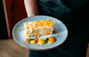 A cheesecake on a plate.