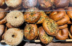 Cabinet full of bagels on display at Downtown Bagels.
