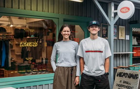 Portrait of Alice & Fionn outside Heatwave store in Wānaka
