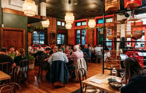 Dining room full of customers in Apache.