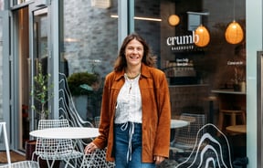 Lucy standing outside Crumb bakery.