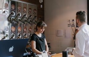 A woman working behind the counter at C4.