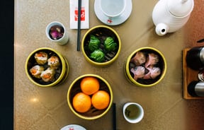 A flatlay of bowls of Chinese food at Dragons Wellington.