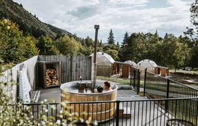 Two people in a hot tub at Cross Hill in Lake Hawea.