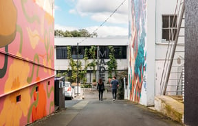 Couple strolling down MADE laneway.