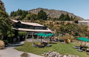 A large building on a hill on a sunny day.