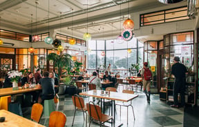 People dining inside St Kevins Arcade in Auckland.