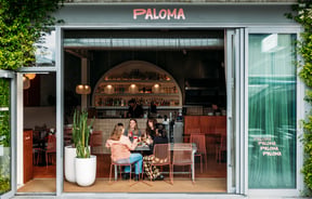 People sitting at a table at Paloma.
