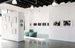 The white crisp interior of an art gallery.