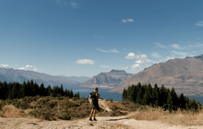 A female walker on top of Queenstown Hill.