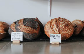 Round loaves of sourdough on a counter.