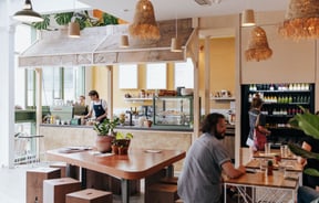 People working inside a busy cafe in Christchurch's South Town.